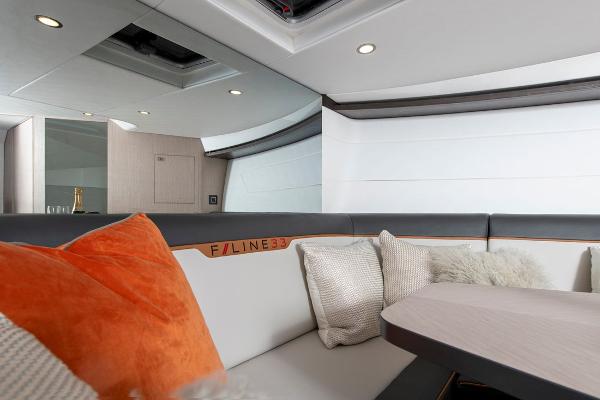 Slide: The Image of 2023 Fairline F//Line 33 Outboard interior with modern seating and plush cushions. - 32