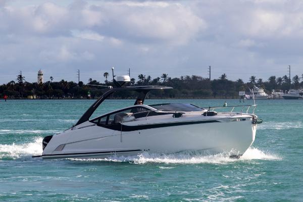 Slide: The Image of 2023 Fairline F//Line 33 Outboard cruising on turquoise waters. - 6