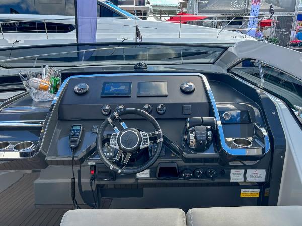 Slide: The Image of 2023 Fairline F//Line 33 Outboard helm station with modern controls and navigation screens. - 9
