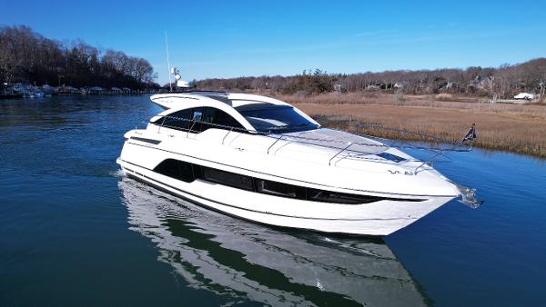 Slide: The Image of 2024 Fairline Targa 45 Open luxury yacht cruising on a calm river. - 1