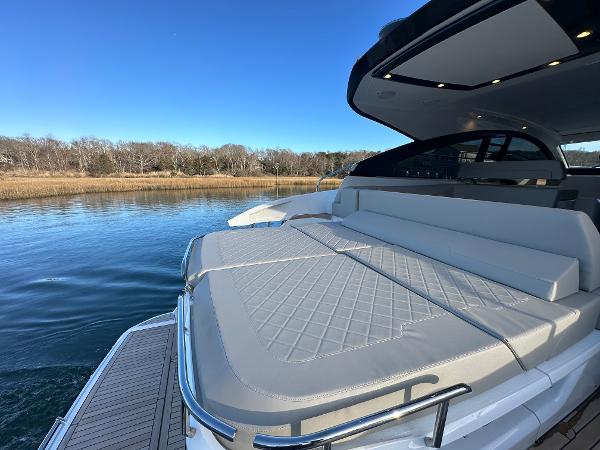 Slide: The Image of 2024 Fairline Targa 45 Open luxury yacht with spacious sunbed and scenic water view. - 11