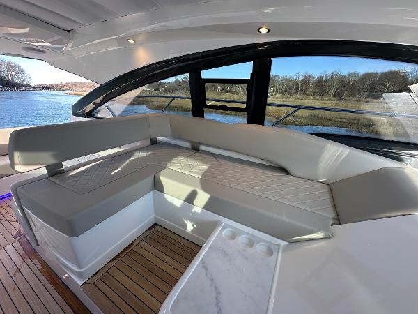 Slide: The Image of Luxurious seating area on the 2024 Fairline Targa 45 Open yacht. - 13