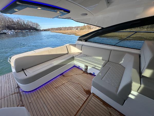 Slide: The Image of Fairline Targa 45 Open 2024 yacht with luxurious seating and scenic water view. - 15