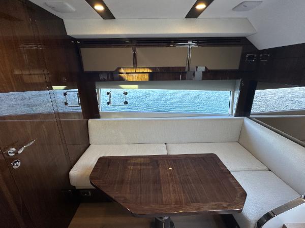 Slide: The Image of Luxurious interior of 2024 Fairline Targa 45 Open yacht with elegant seating and wooden table. - 19