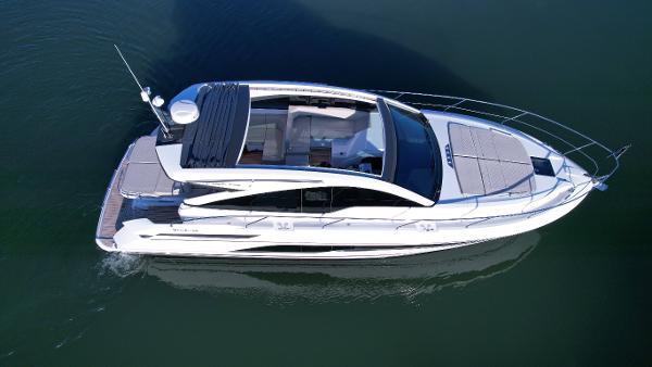 Slide: The Image of 2024 Fairline Targa 45 Open luxury yacht cruising on water. - 2