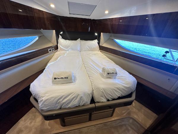 Slide: The Image of Luxurious bedroom in 2024 Fairline Targa 45 Open yacht with twin beds and ocean view. - 23