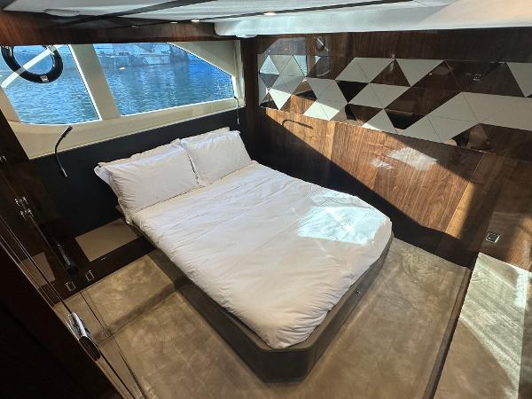 Slide: The Image of Luxurious bedroom in 2024 Fairline Targa 45 Open yacht with modern design and waterfront view. - 27