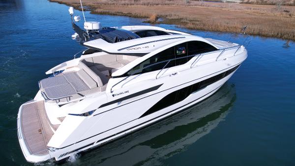 Slide: The Image of 2024 Fairline Targa 45 Open luxury yacht cruising on water. - 3