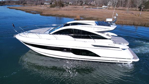 Slide: The Image of 2024 Fairline Targa 45 Open luxury yacht cruising on a calm river. - 6