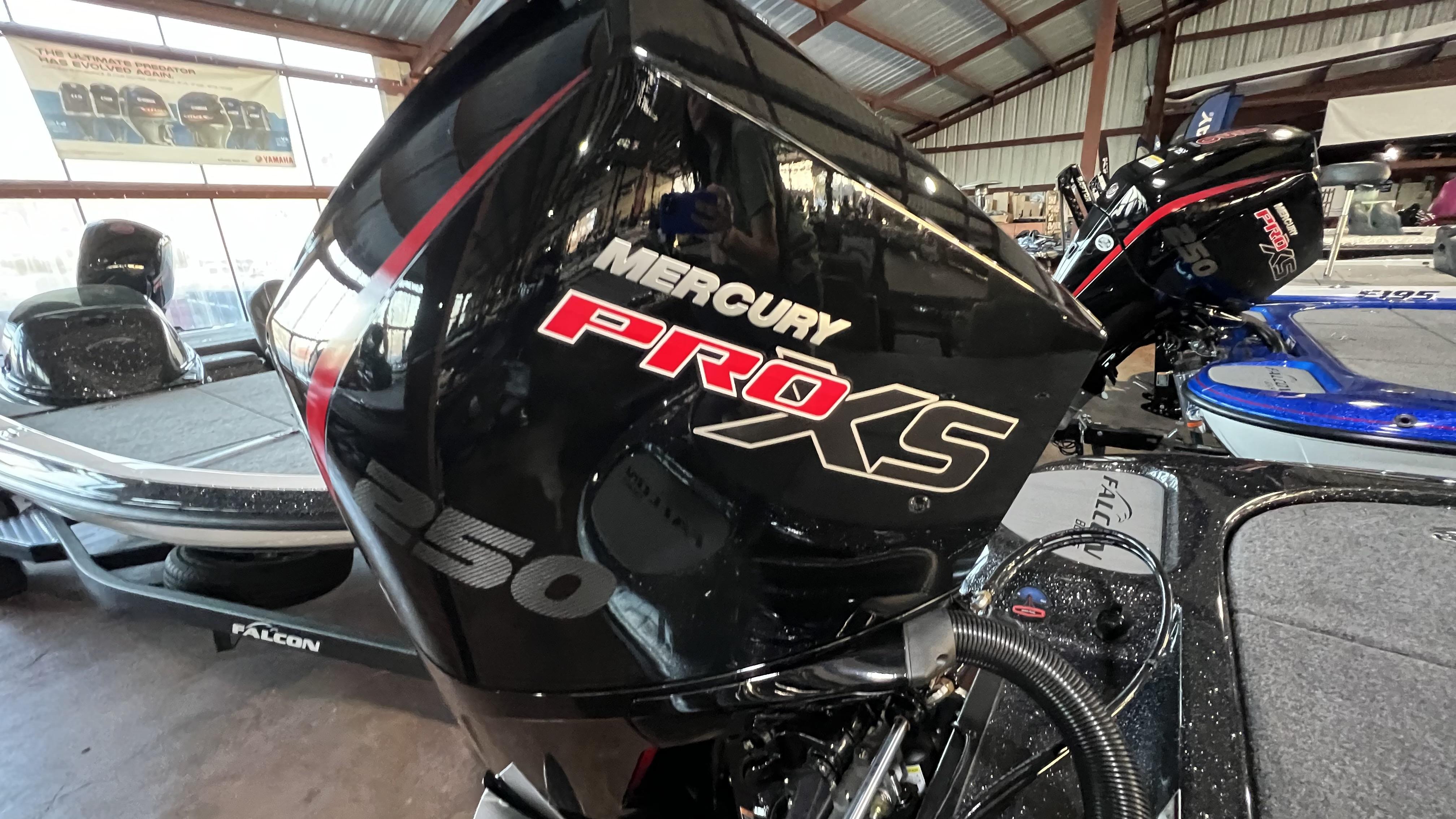 Slide: The Image of 2024 Falcon F205 boat with Mercury Pro XS 250 engine in a showroom. - 10