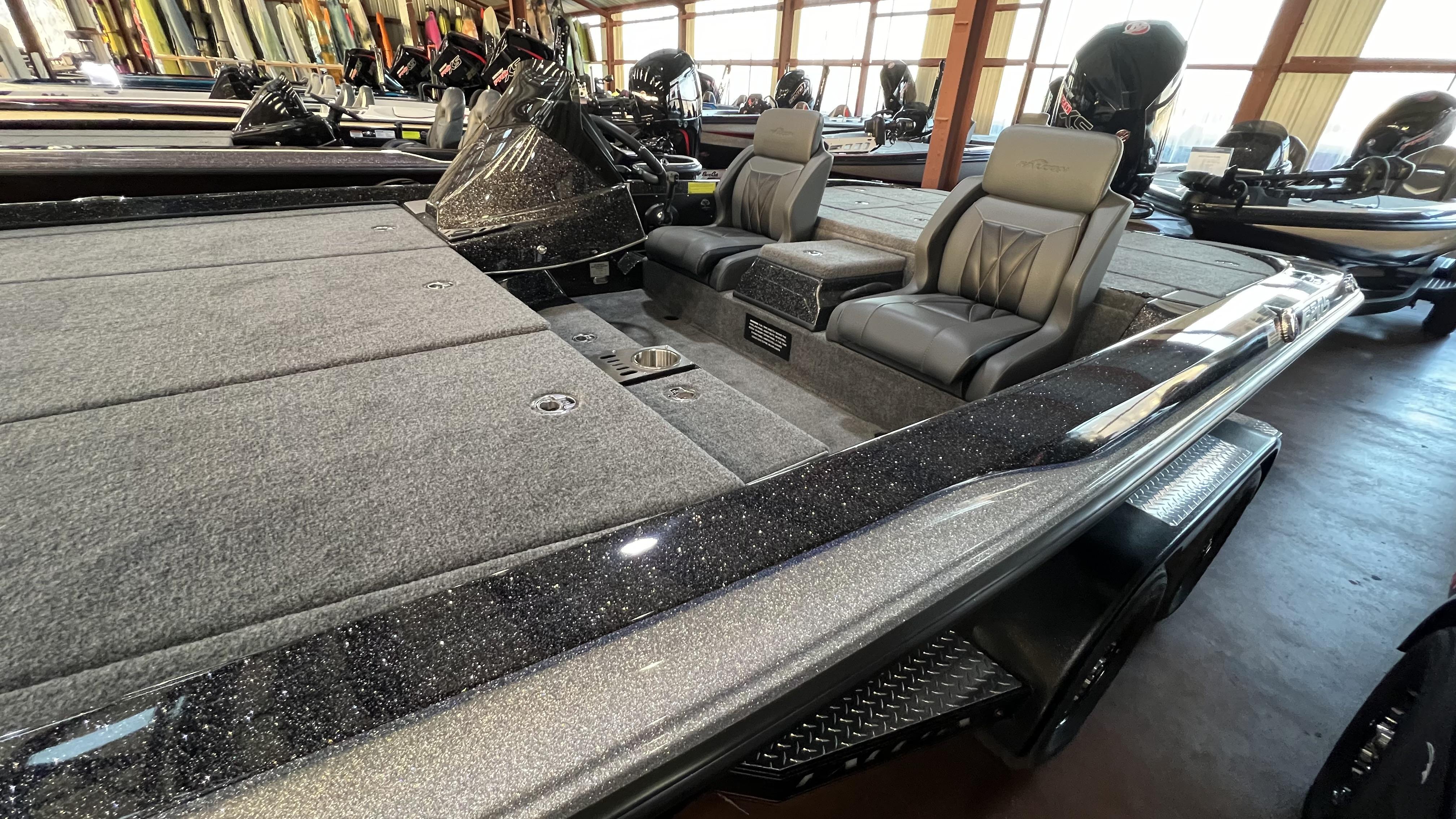Slide: The Image of 2024 Falcon F205 boat interior with gray seats and carpeted deck. - 15