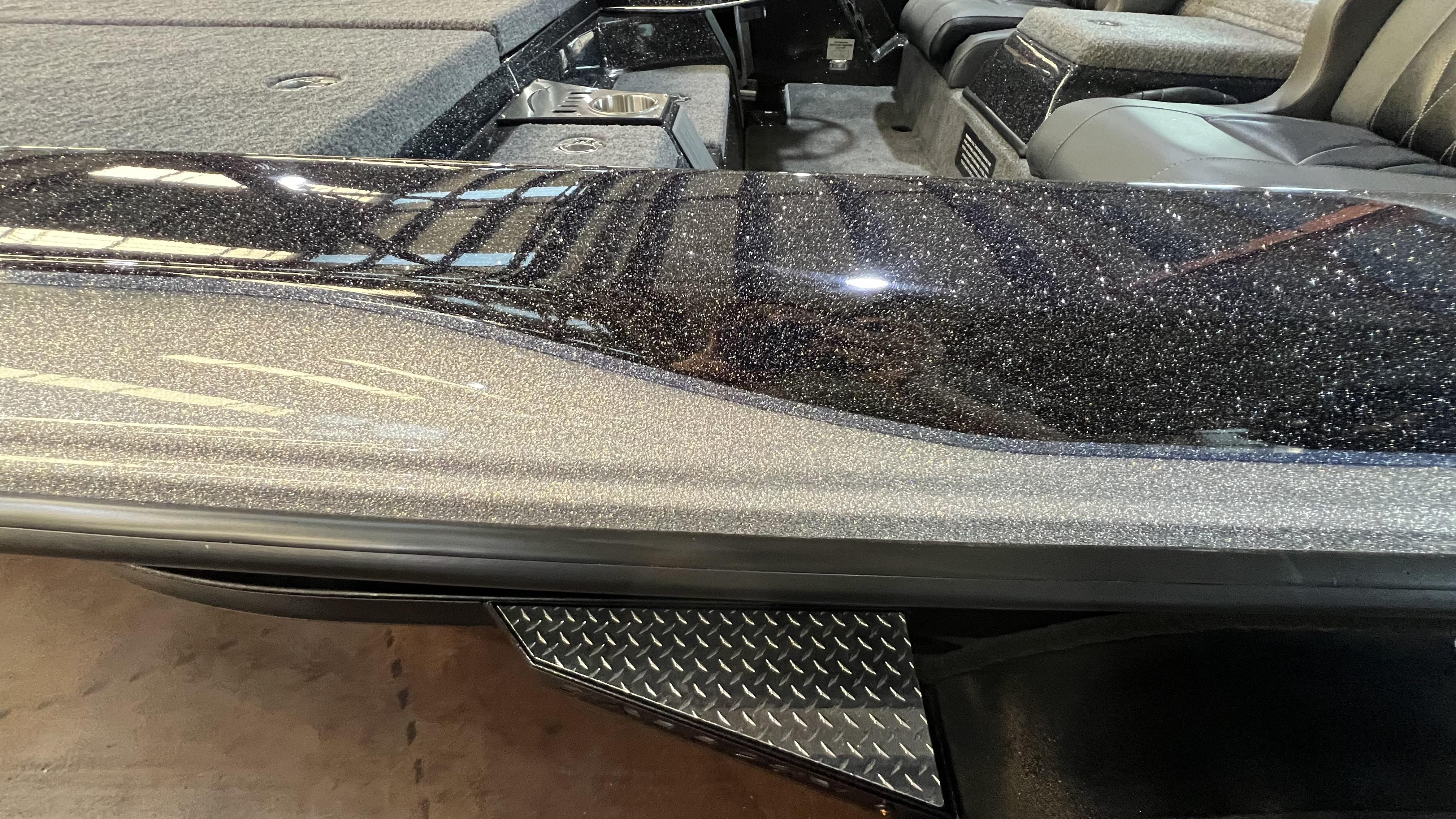 Slide: The Image of 2024 Falcon F205 boat interior with glitter finish and diamond plate accents. - 16