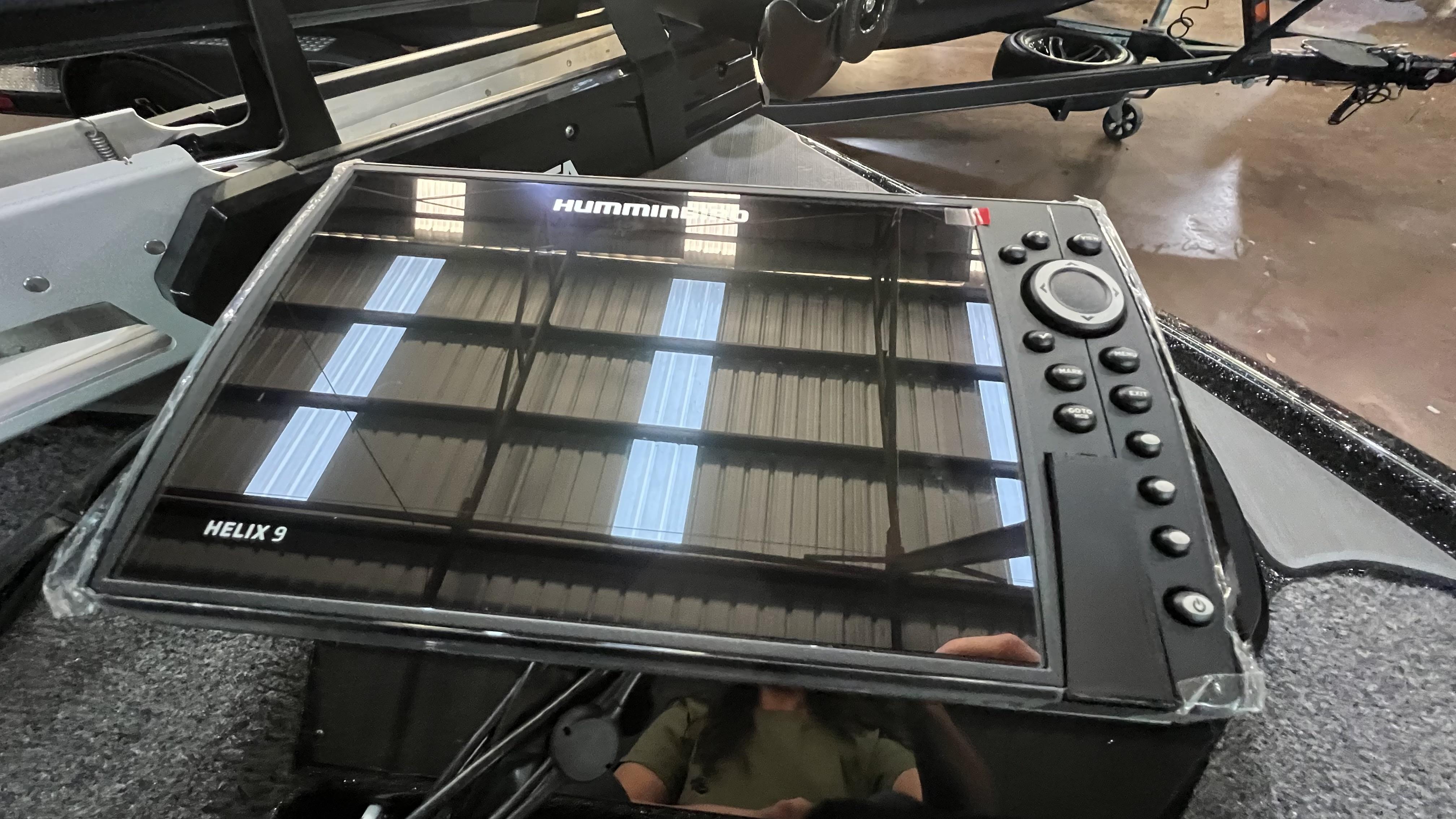 Slide: The Image of Humminbird Helix 9 fish finder on a 2024 Falcon F205 boat. - 18