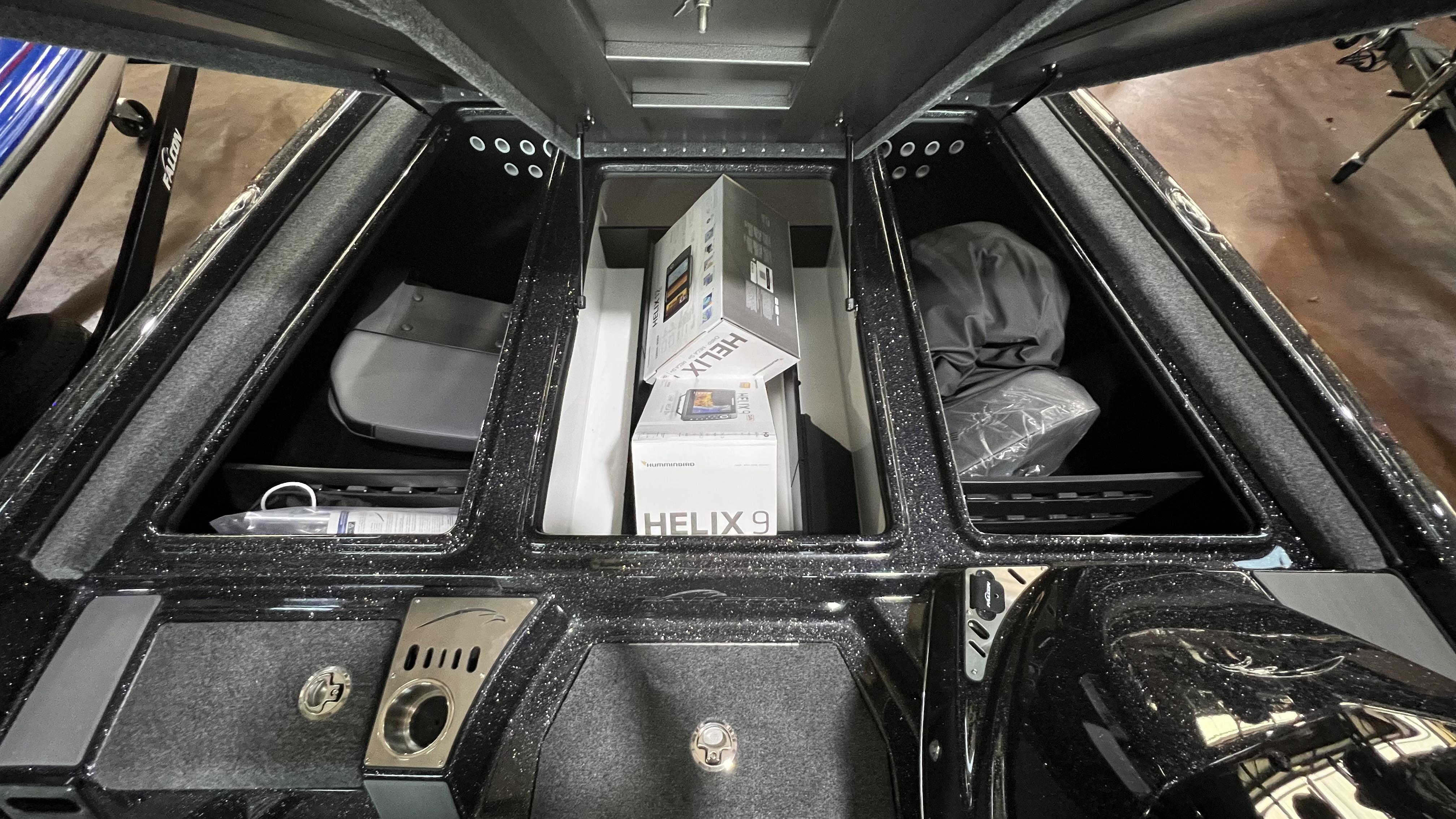 Slide: The Image of Storage compartments of a 2024 Falcon F205 boat with Helix 9 electronics. - 19