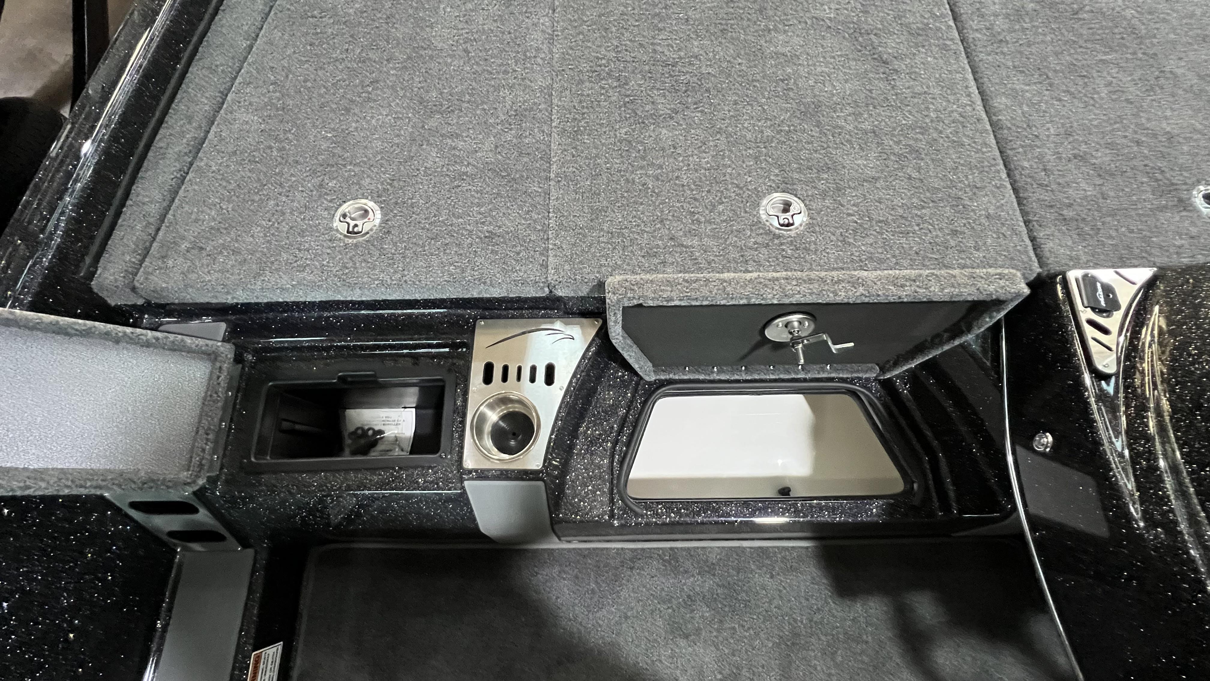 Slide: The Image of 2024 Falcon F205 boat storage compartments and control panel. - 20