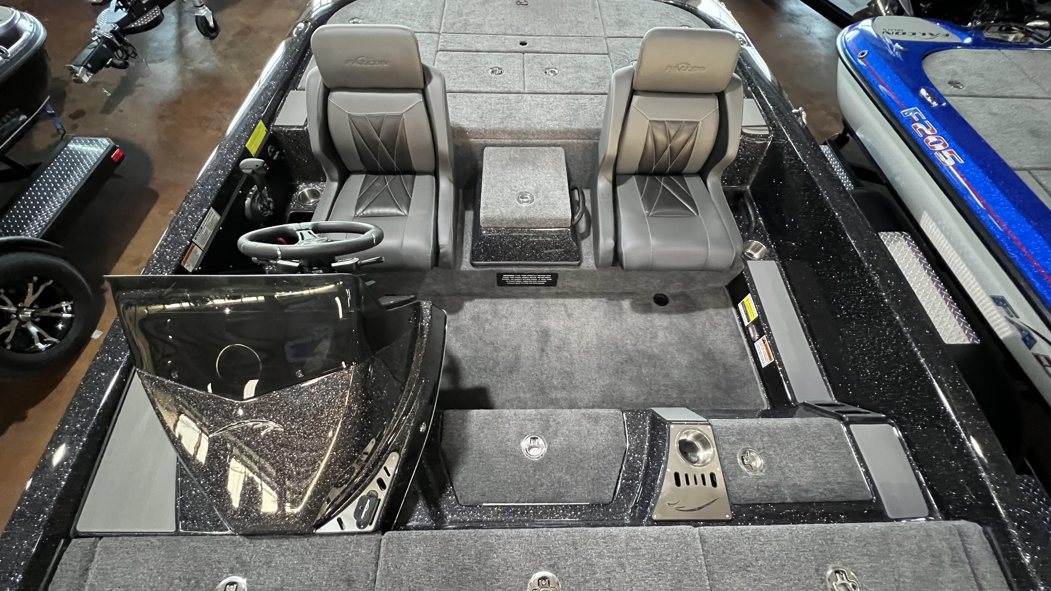 Slide: The Image of 2024 Falcon F205 boat interior with dual seats and steering console. - 21
