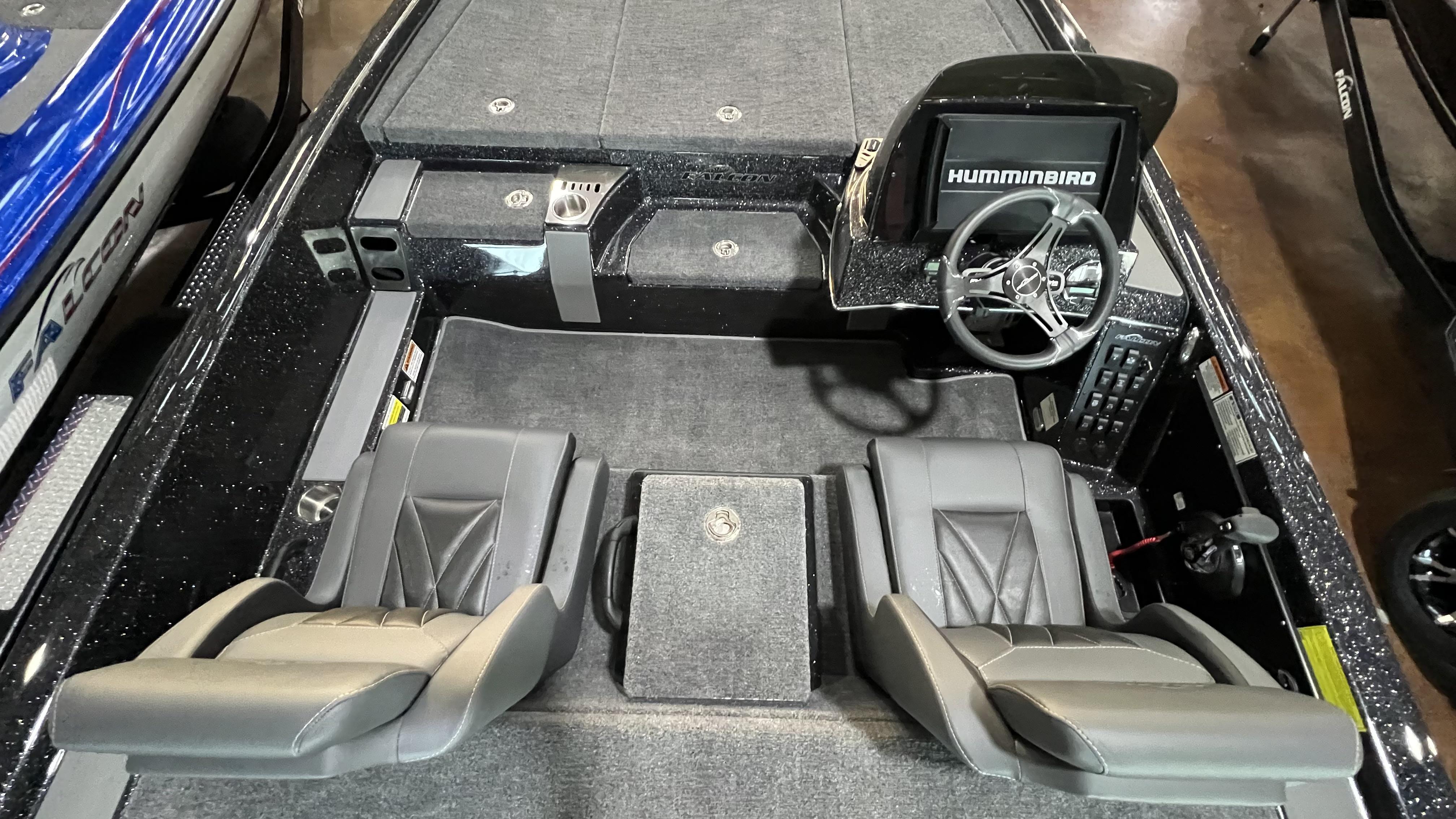 Slide: The Image of 2024 Falcon F205 boat interior with dual seats and Humminbird navigation system. - 22
