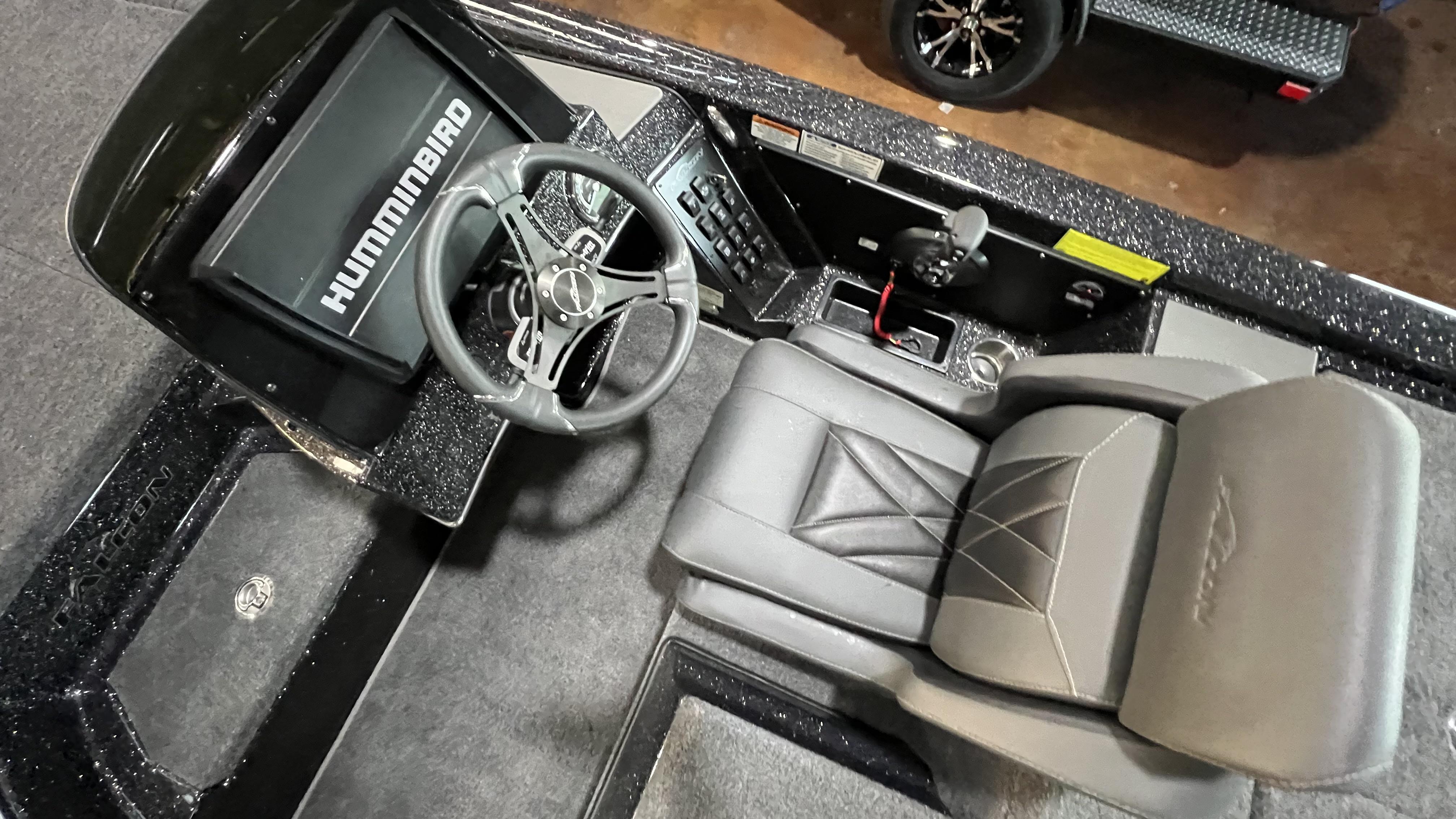 Slide: The Image of Cockpit view of 2024 Falcon F205 boat with Humminbird electronics and premium seating. - 23
