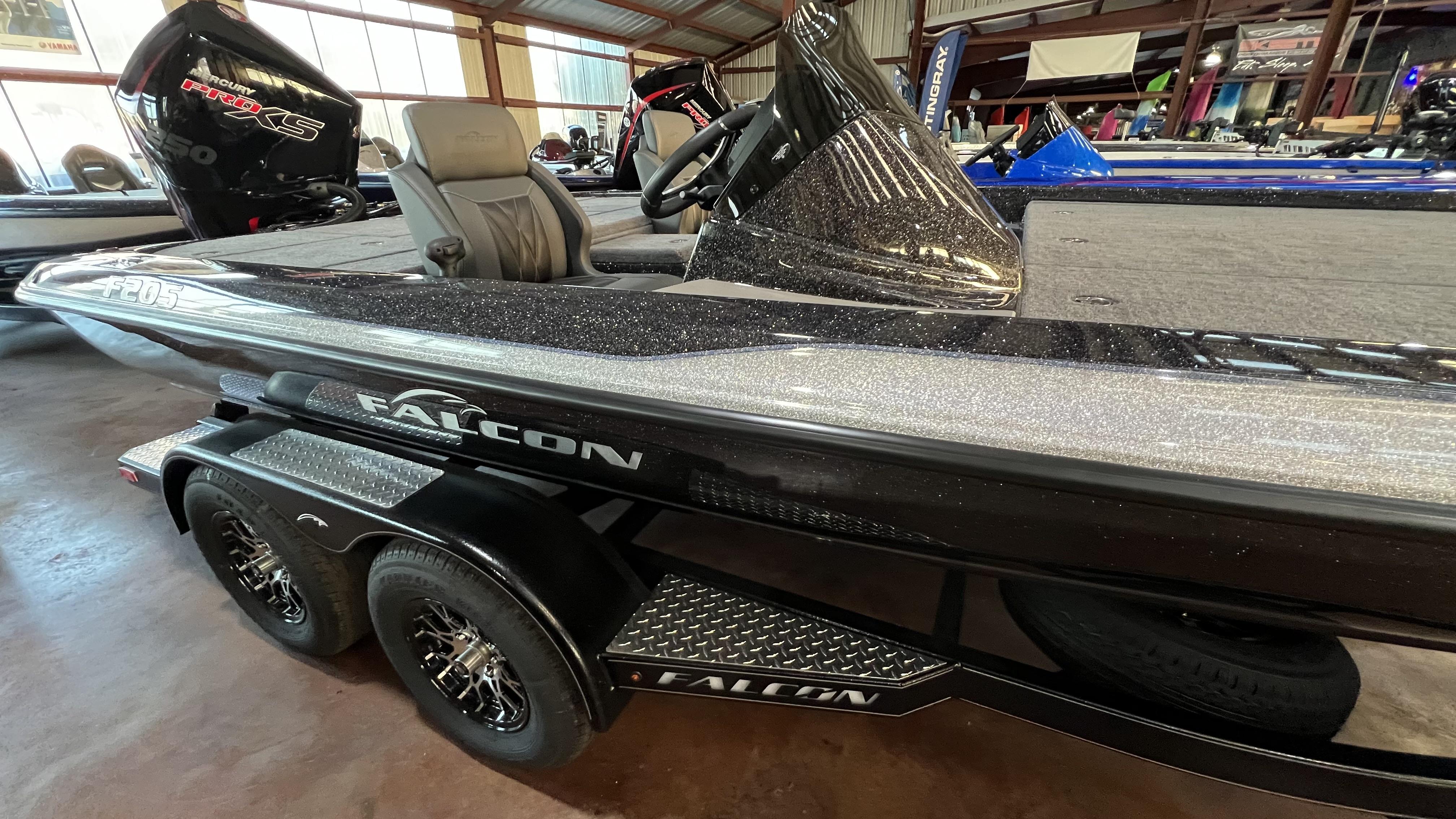 Slide: The Image of 2024 Falcon F205 boat with Mercury Pro XS engine in showroom. - 3