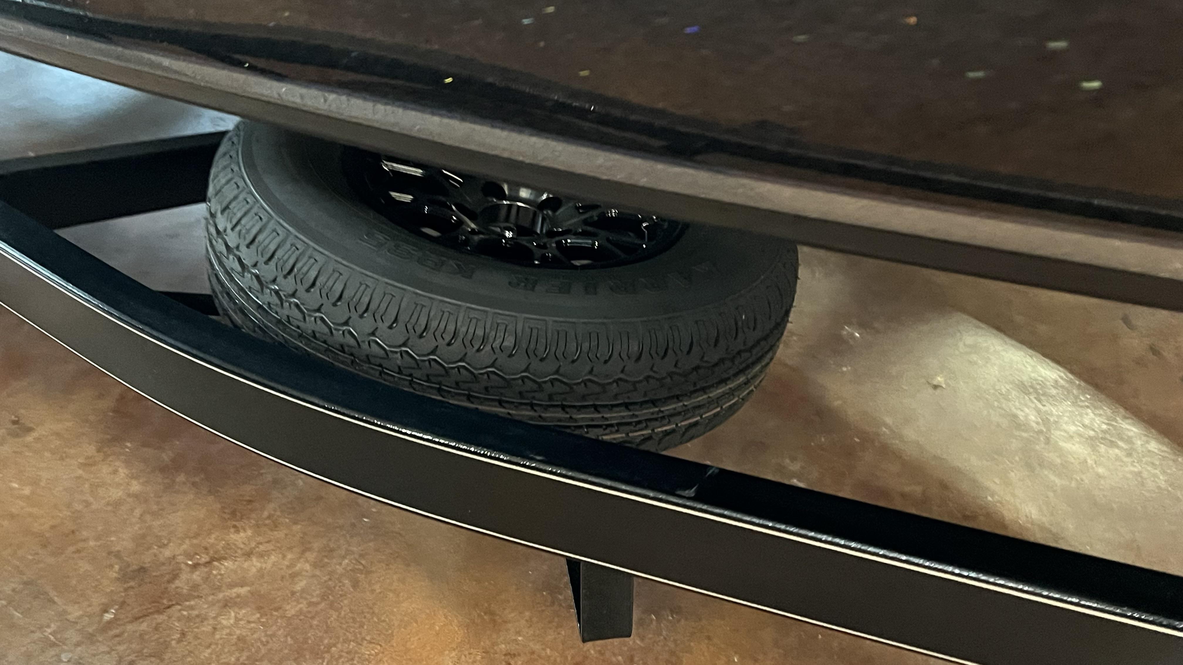 Slide: The Image of 2024 Falcon F205 spare tire mounted under vehicle. - 5