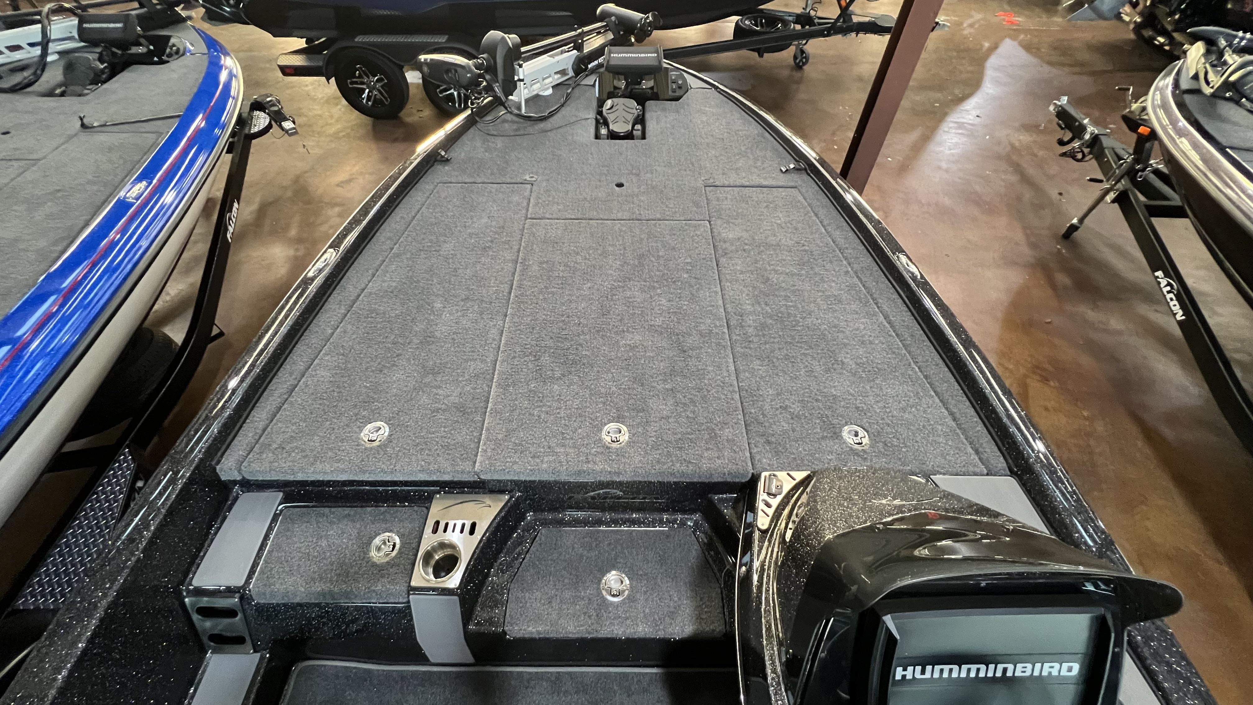 Slide: The Image of 2024 Falcon F205 boat deck with Humminbird electronics and storage compartments. - 6