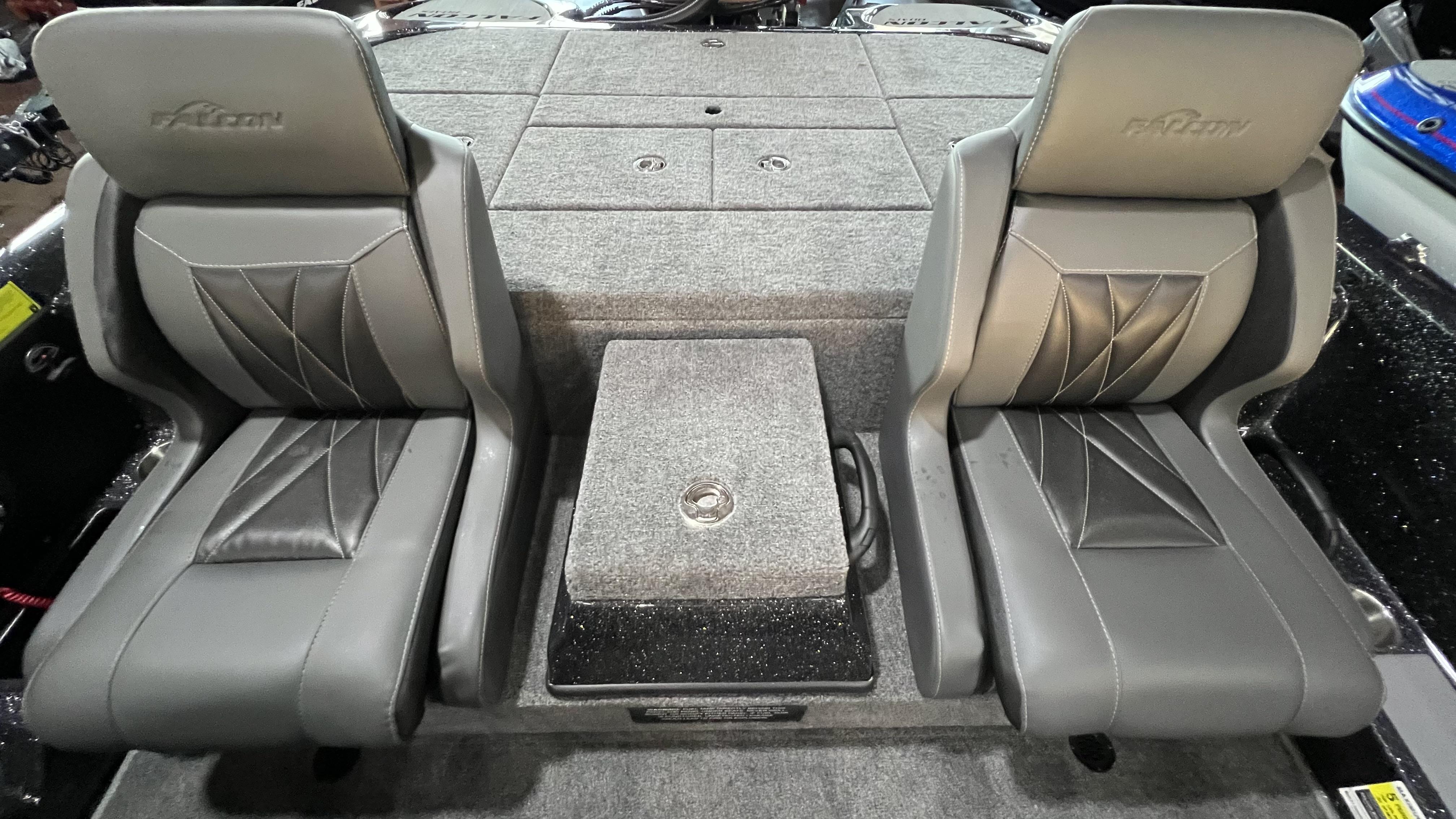 Slide: The Image of 2024 Falcon F205 boat interior with dual gray seats and storage compartments. - 7