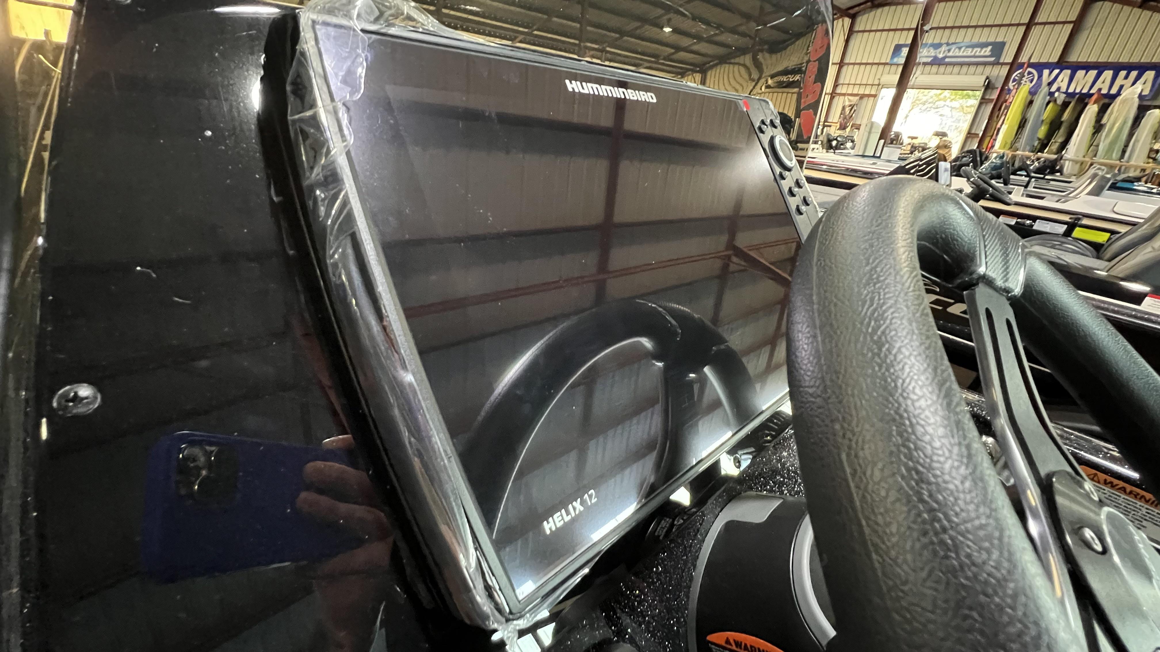 Slide: The Image of Close-up of Humminbird Helix 12 fishfinder on 2024 Falcon F205 boat. - 8