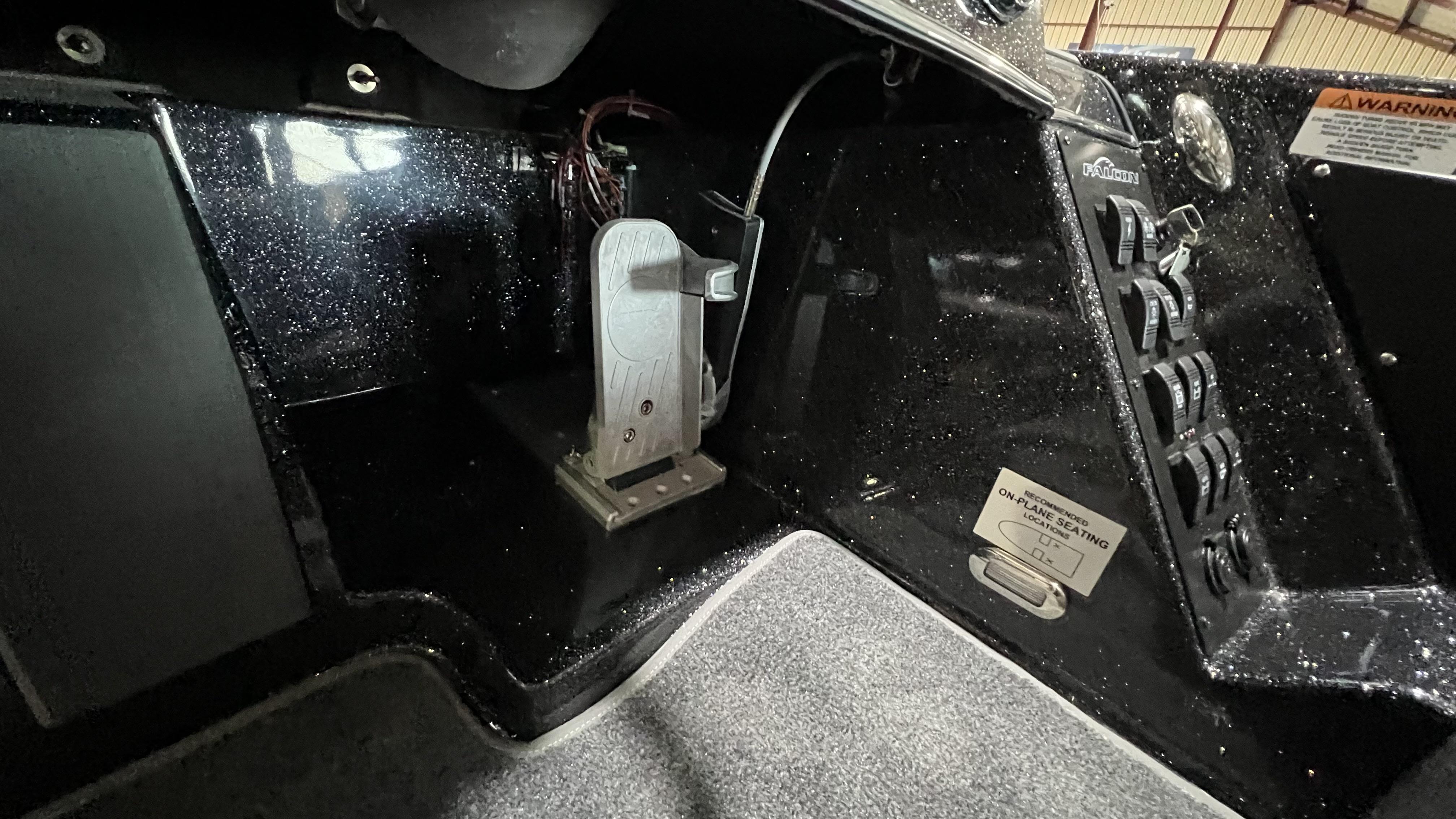 Slide: The Image of 2024 Falcon F205 boat interior, control panel and foot pedal. - 9