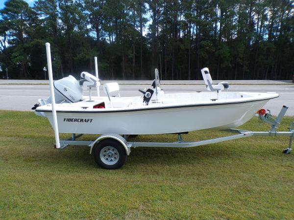 Slide: The Image of 2023 Fibercraft 160 Pro Vee boat on trailer, parked on grass. - 1