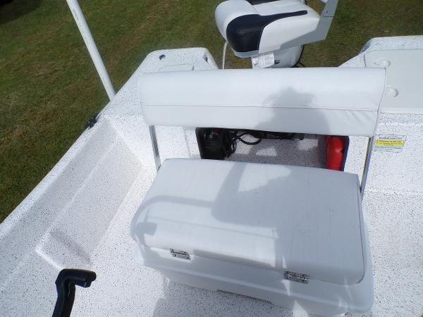 Slide: The Image of 2023 Fibercraft 160 Pro Vee boat interior with white seating and storage. - 10
