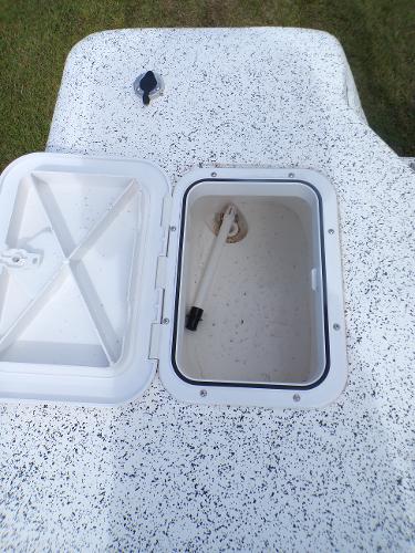 Slide: The Image of Open storage compartment on a 2023 Fibercraft 160 Pro Vee boat. - 13