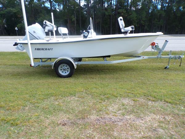 Slide: The Image of 2023 Fibercraft 160 Pro Vee boat on trailer, side view. - 2