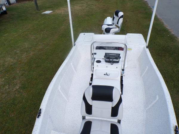 Slide: The Image of 2023 Fibercraft 160 Pro Vee boat interior with black and white seating. - 6