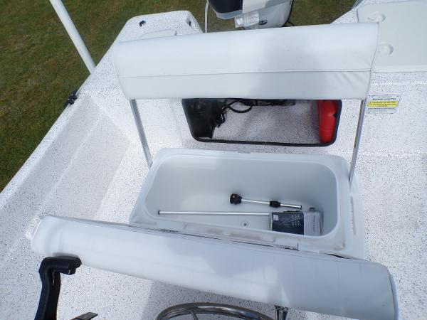 Slide: The Image of 2023 Fibercraft 160 Pro Vee boat with open storage compartment and white seating. - 9