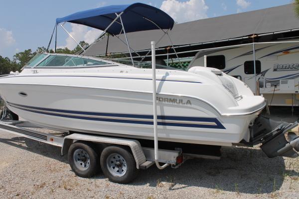 Slide: The Image of 2001 Formula 260 Sun Sport boat on trailer with blue canopy. - 1