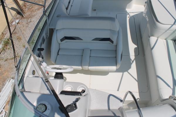 Slide: The Image of 2001 Formula 260 Sun Sport boat interior with white seating and steering wheel. - 11