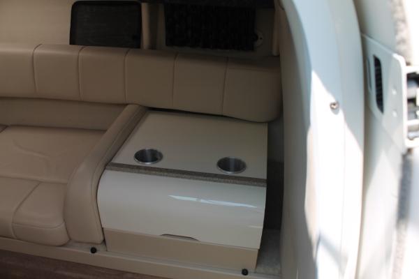 Slide: The Image of Interior of 2001 Formula 260 Sun Sport with beige seating and cup holders. - 14