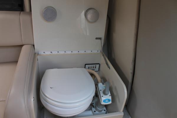 Slide: The Image of 2001 Formula 260 Sun Sport boat interior with compact marine toilet. - 15