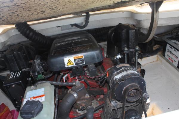 Slide: The Image of 2001 Formula 260 Sun Sport engine compartment with visible components and battery. - 16