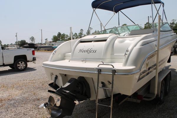 Slide: The Image of 2001 Formula 260 Sun Sport boat with "Hookless" name, parked on a trailer. - 4