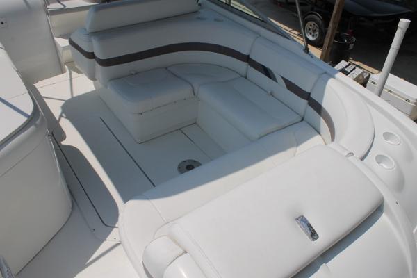 Slide: The Image of 2001 Formula 260 Sun Sport boat interior with white seating and cup holders. - 7