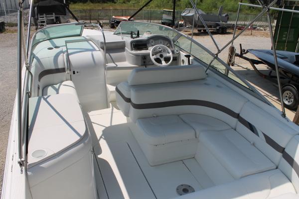 Slide: The Image of 2001 Formula 260 Sun Sport boat interior with white seating and steering wheel. - 8