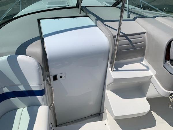 Slide: The Image of 2003 Formula 27 PC boat interior with seating and steps, featuring sleek white design. - 4