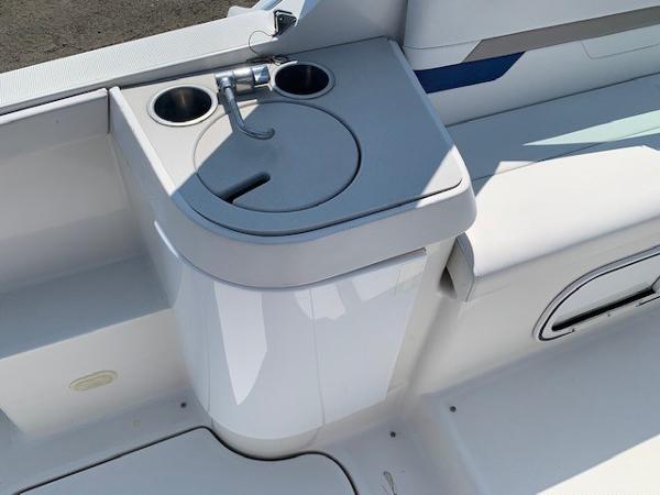 Slide: The Image of 2003 Formula 27 PC boat interior with sink and cup holders. - 6