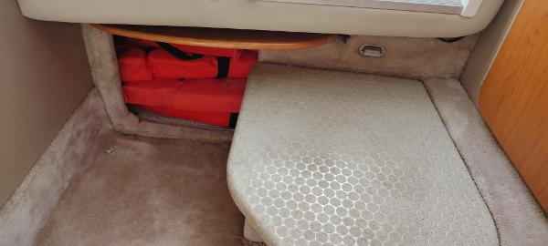 Slide: The Image of Interior storage area of a 2004 Formula 280 Sun Sport boat with life jackets. - 14