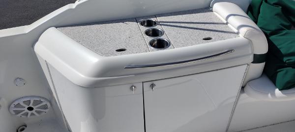 Slide: The Image of 2004 Formula 280 Sun Sport boat interior with cup holders and storage. - 15