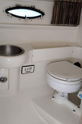 Slide: The Image of 2004 Formula 280 Sun Sport boat bathroom with sink and toilet. - 19