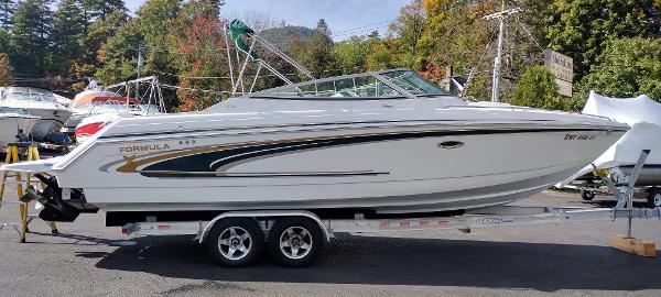 Slide: The Image of 2004 Formula 280 Sun Sport boat on a trailer in a marina. - 5