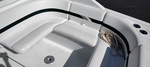 Slide: The Image of 2004 Formula 280 Sun Sport boat with white leather seating and cup holders. - 8