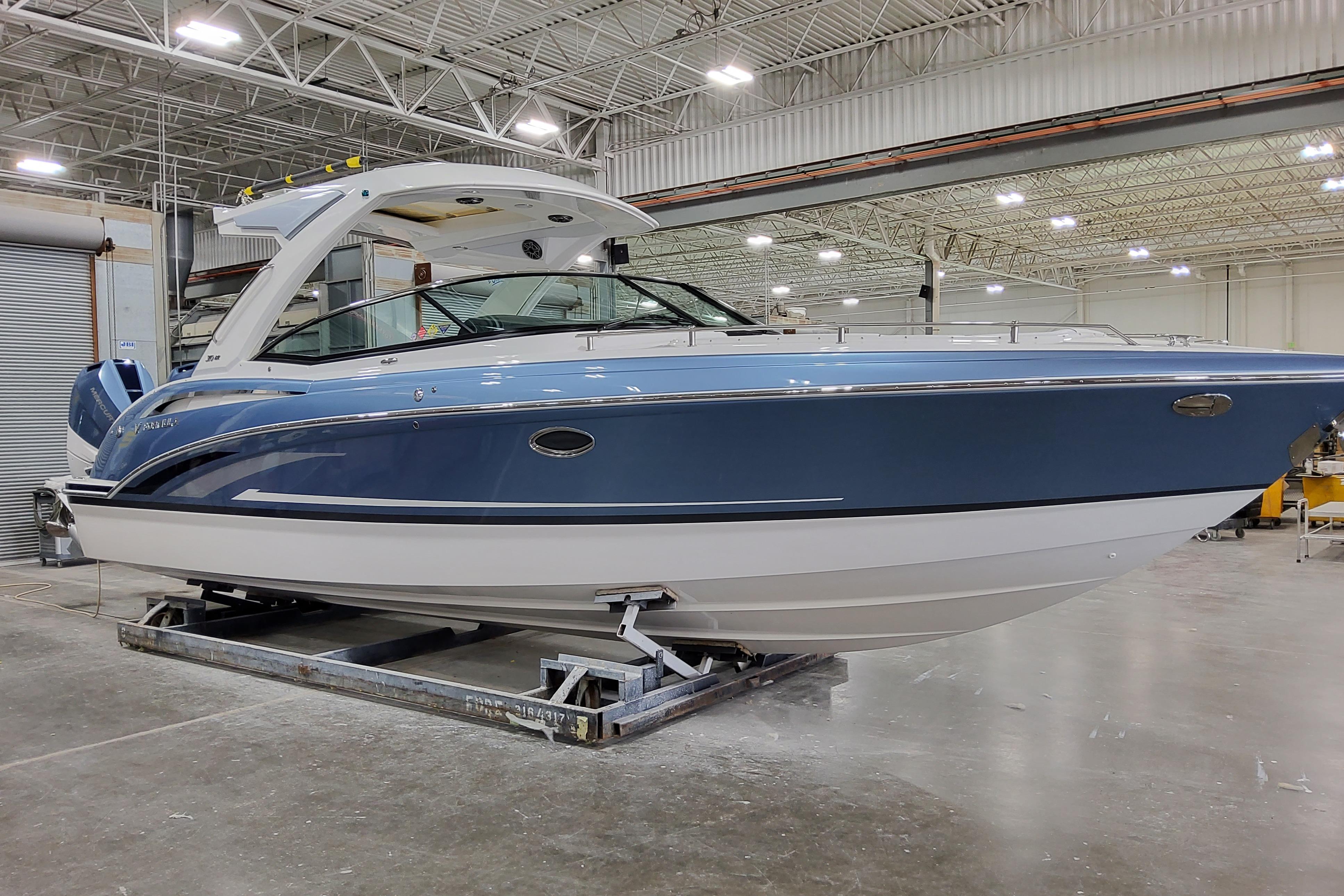 Slide: The Image of 2026 Formula 310 Bowrider OB in a showroom, showcasing sleek design and modern features. - 1
